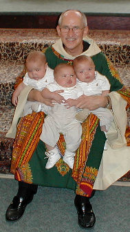 Father holds Matthe, Mark and Luke